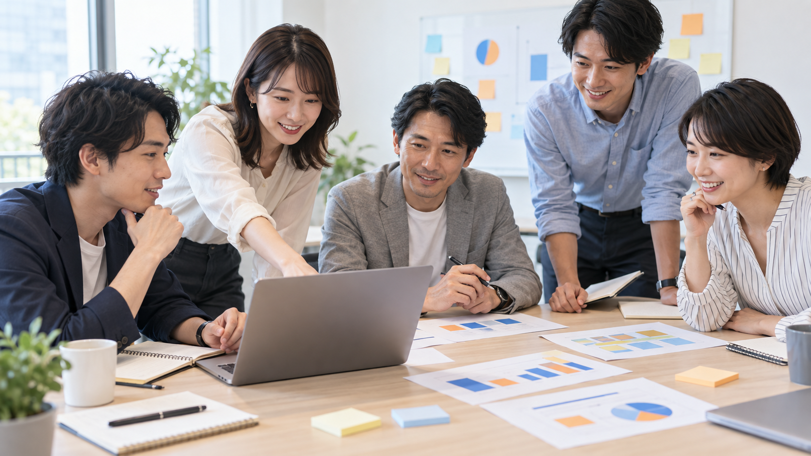 資料、表計算、プレゼンテーションを共有しながら業務フローを話し合うチーム